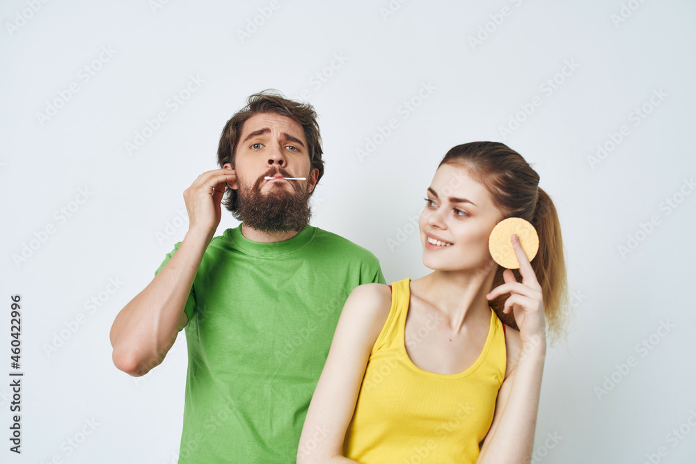 man and woman in the bathroom morning care hygiene man and woman in the bathroom morning care hygiene