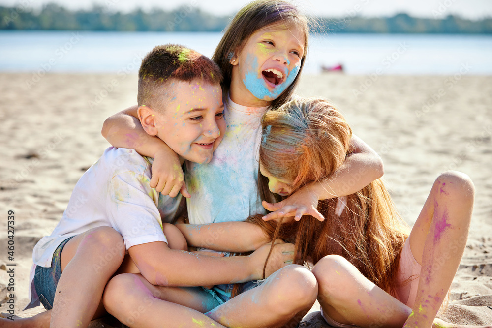 kids having fun by playing with colored powder kids having fun by playing with colored powder
