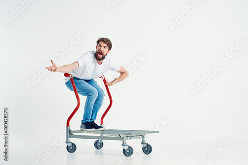 Man in a white t-shirt transport in a box light background