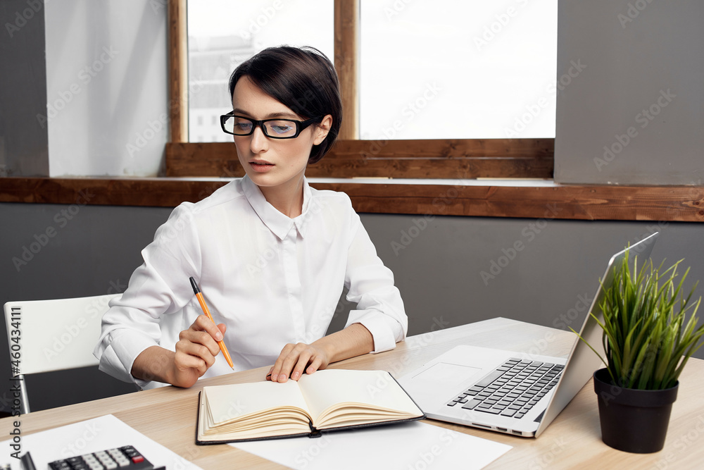 Businesswoman at the desk Secretary executive light background Businesswoman at the desk Secretary executive light background