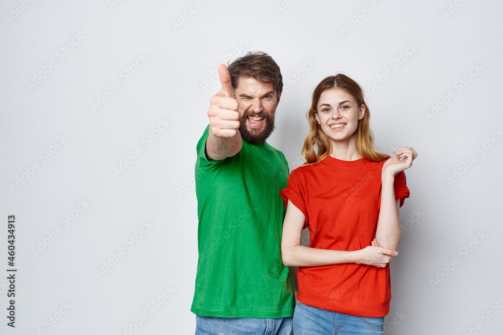 married couple hug friendship colorful t-shirts family light background married couple hug friendship colorful t-shirts family light background