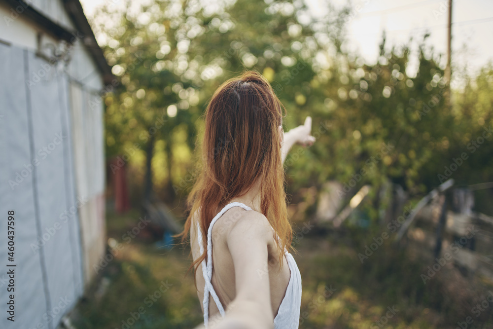 Naklejka premium woman in white dress summer countryside Sun freedom