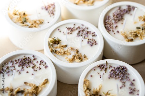 Hand-made concrete candles with dried flowers, scented soy wax vegan candles photo