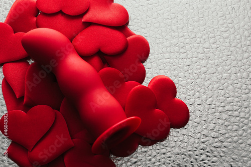 red dildo with lots of hearts symbolizes the love of masturbation and nymphomania; design for intimate services