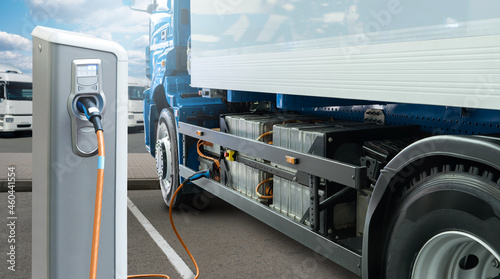 Canvas Print Electric truck batteries are charged from the charging station