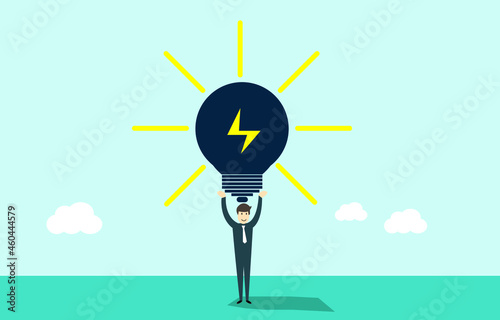 Light bulb of ideas in the hands of a businessman above his head