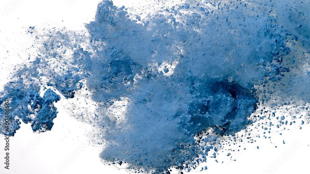Drops of blue ink in water. Colored acrylic paints in water. Light blue watercolor ink in water on a white background. Blue cloud of ink on a white background.