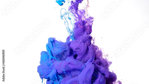 Colored cloud of ink on a white background. Blue, purple and pink watercolor ink in water on a white background. Beautiful abstract background.