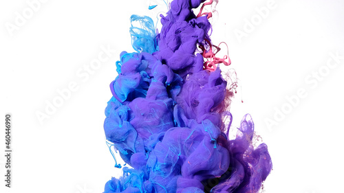 Beautiful abstract background. Blue, purple and pink acrylic paints are mixed in water. Colored cloud of ink on a white background.