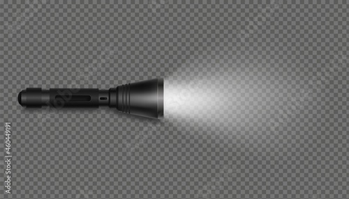 Black flashlight with light on isolated template. Realistic pocket device illuminates surface with beam