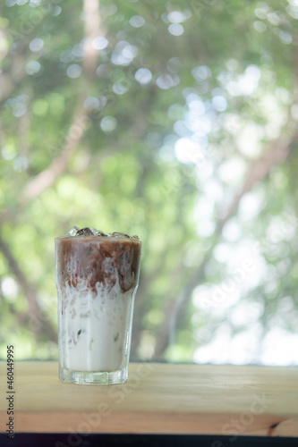 Two layers of coffee and milk with ice