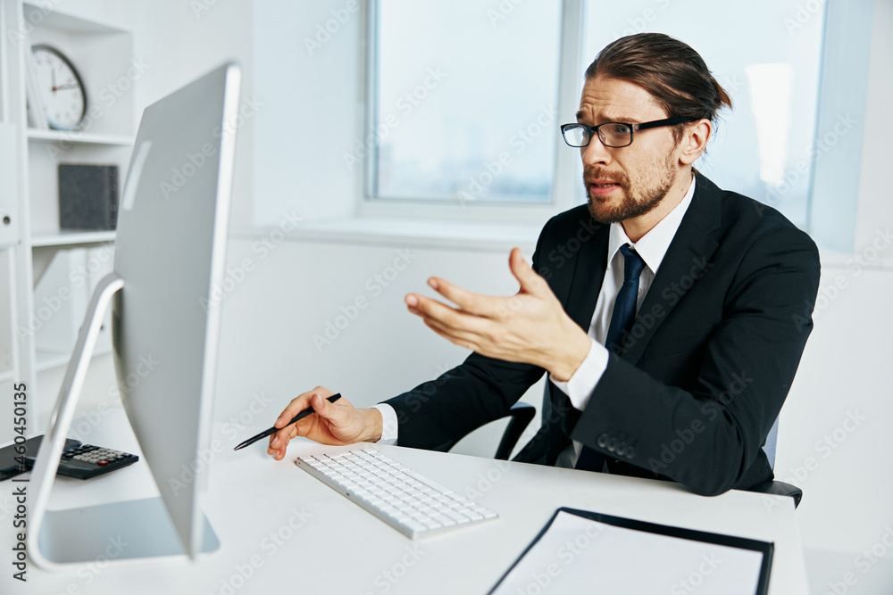 male manager near the desktop office computer Chief