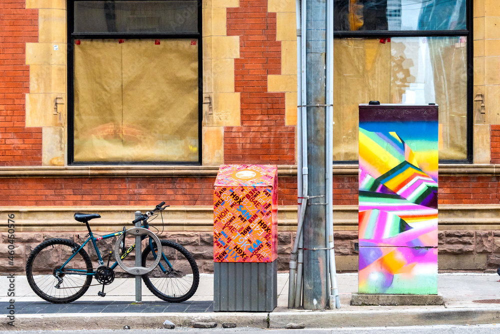 Urban art in stop-light control box in Toronto, Canada