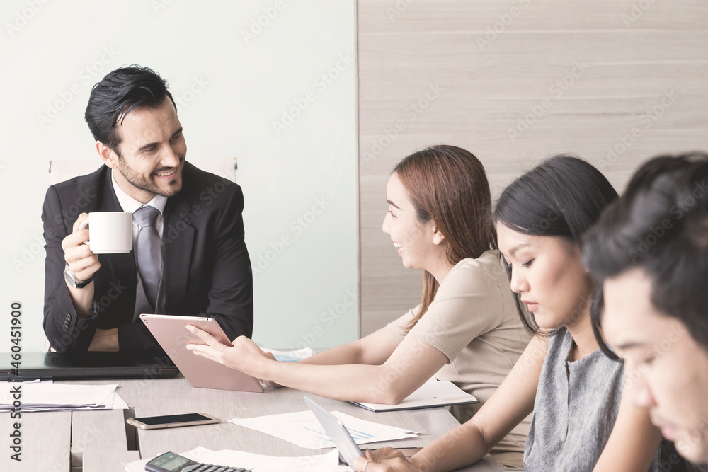 Portrait of manager and his team at meeting room in office. Portrait of manager and his team at meeting room in office.