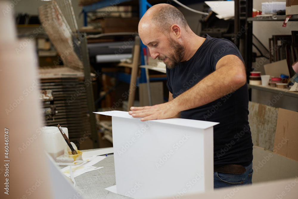 book binder working in a workshop