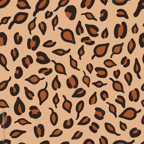 Leopard or jaguar seamless pattern made of fall leaves. Trendy animal print with autumn colors. Vector background for fabric, textile, wallpaper, wrapping paper, etc