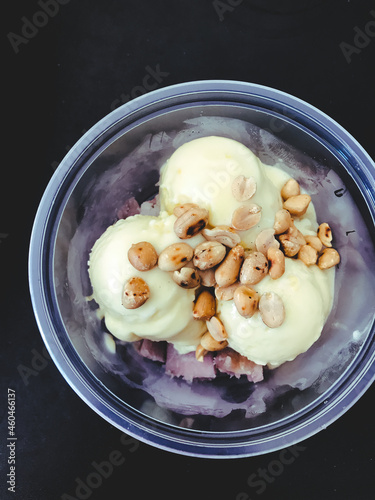 Ice cream with beans on the black table.