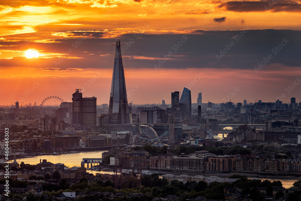 Elevated sunset view to the urban skyline of London with all major tourist attractions along the Thames river