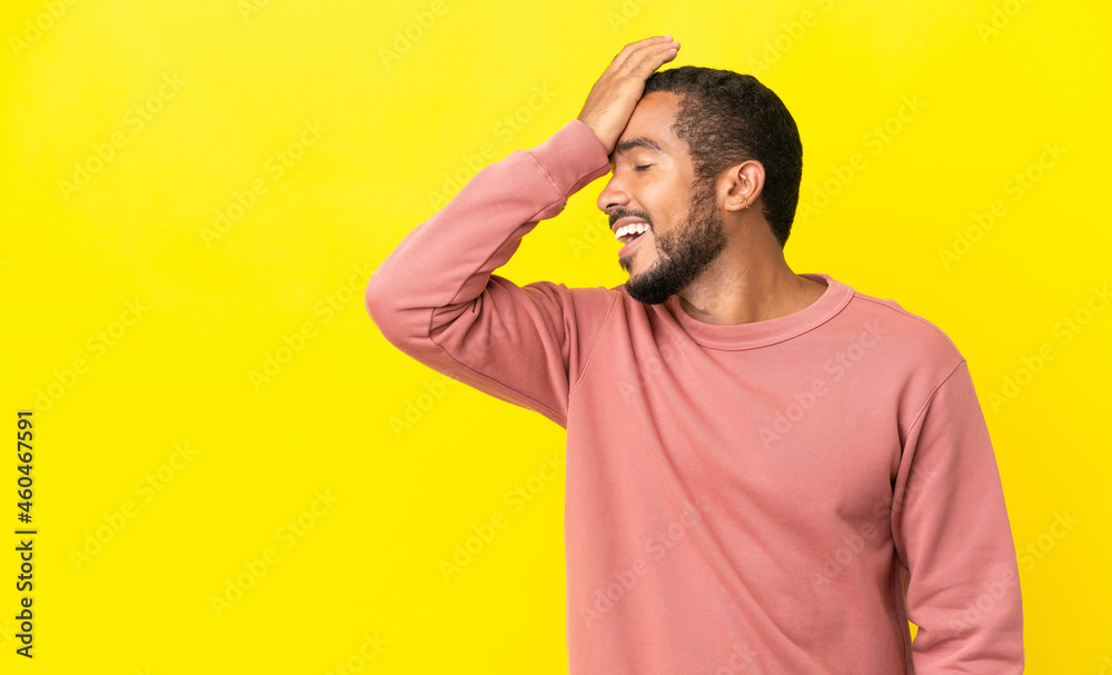 Young latin man isolated on yellow background has realized something and intending the solution Young latin man isolated on yellow background has realized something and intending the solution
