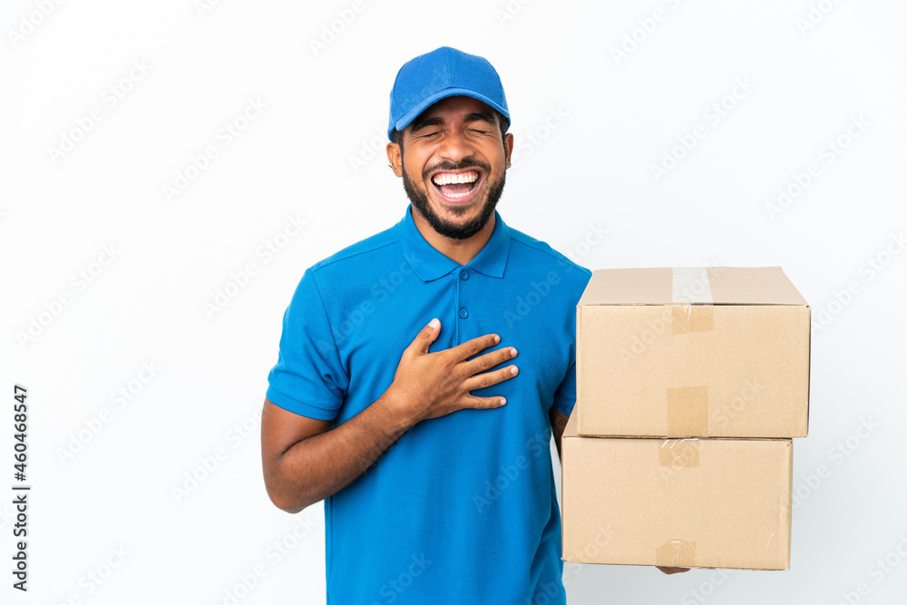 Delivery Ecuadorian man isolated on white background smiling a lot Delivery Ecuadorian man isolated on white background smiling a lot