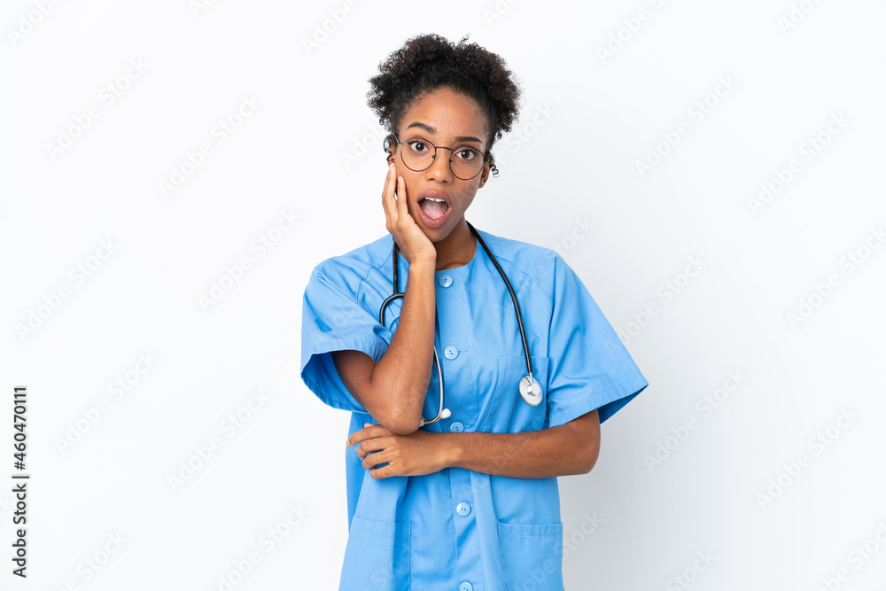 Young surgeon African American doctor woman isolated on white background surprised and shocked while looking right Young surgeon African American doctor woman isolated on white background surprised and shocked while looking right
