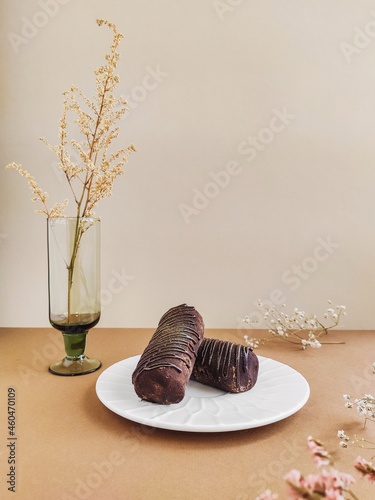 Chocolate brownies on white plate (ID: 460470109)