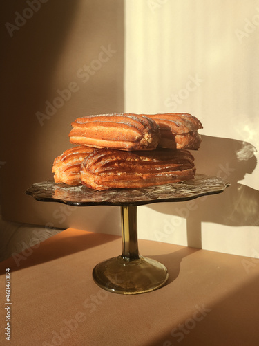 Éclairs with icing sugar (ID: 460470124)