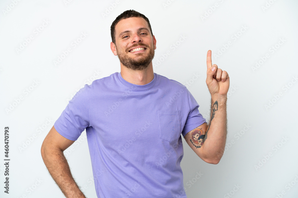 Young Brazilian man isolated on white background showing and lifting a finger in sign of the best Young Brazilian man isolated on white background showing and lifting a finger in sign of the best