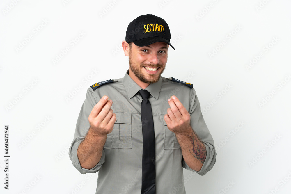 Young security Brazilian man isolated on white background making money gesture Young security Brazilian man isolated on white background making money gesture