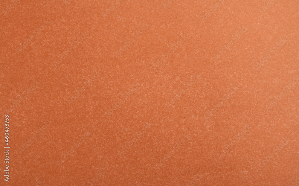 Abstract red glossy paper texture background or backdrop. Empty wrapping paper or shiny paperboard for decorative design element. Grainy surface for Christmas holiday or Chinese new year concept Abstract red glossy paper texture background or backdrop. Empty wrapping paper or shiny paperboard for decorative design element. Grainy surface for Christmas holiday or Chinese new year concept