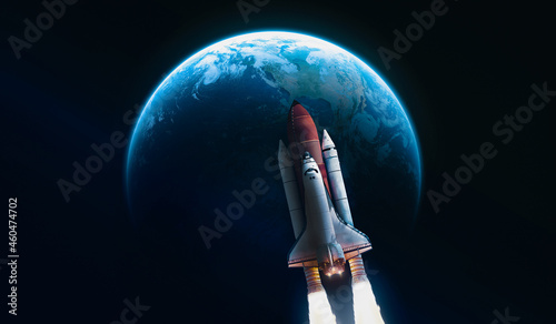 Shuttle rocket on orbit of Earth planet sphere. Black dark space. Space craft in deep galaxy. Continents and oceans. Elements of this image furnished by NASA
