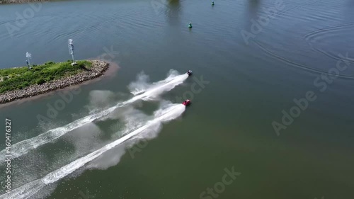 Aerial view of two jet skis moving fast over water it is generically to refer to any type of personal watercraft used mainly for recreation and it is also used to describe the use of any type of PWC photo