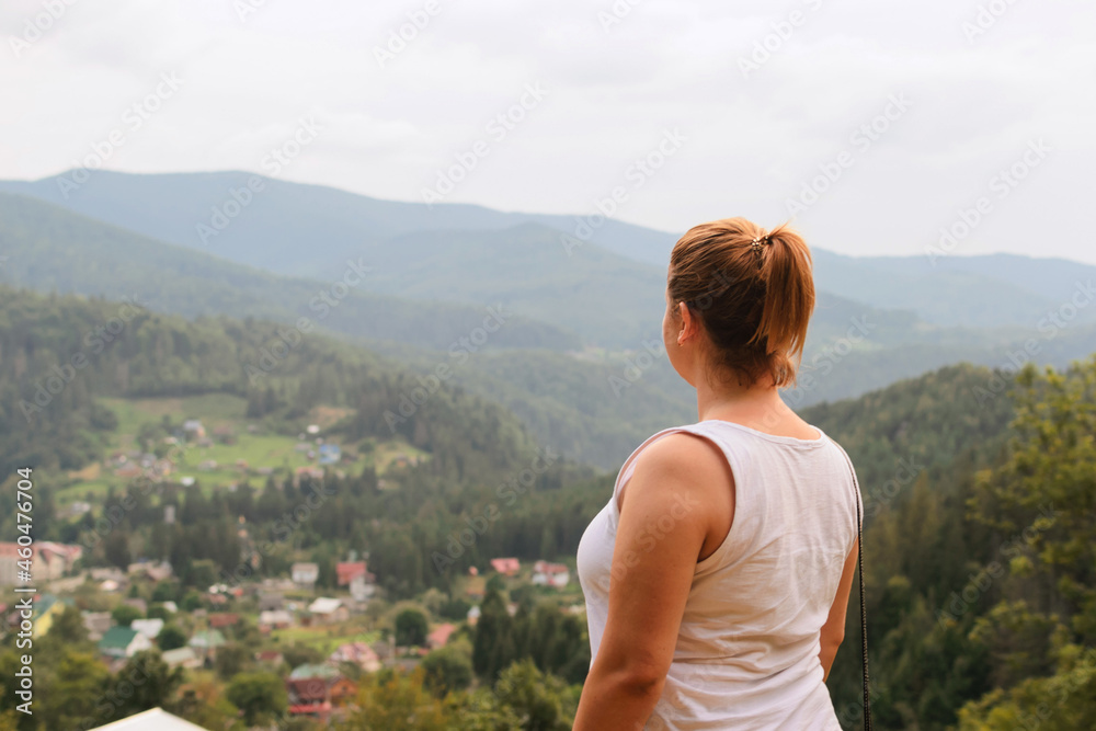 Beautiful woman among nature. Relaxation in the hills and forests. High in the mountains. Beautiful woman among nature. Relaxation in the hills and forests. High in the mountains.
