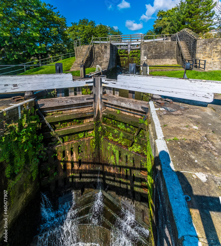 A view of closed lock gates on the Five Locks network on the Leeds, Liverpool canal at Bingley, Yorkshire, UK in summertime photo