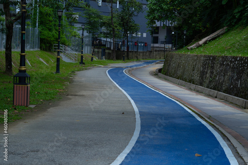Photography Peaceful empty lane for cycling and jogging in the public park in Kepong, Kuala Lumpur, Malaysia