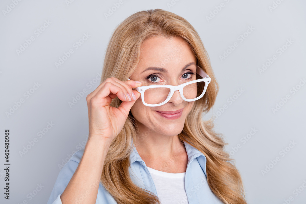 Portrait of smiling beautiful businesswoman wear spectacles glasses intelligent clever isolated on grey color background