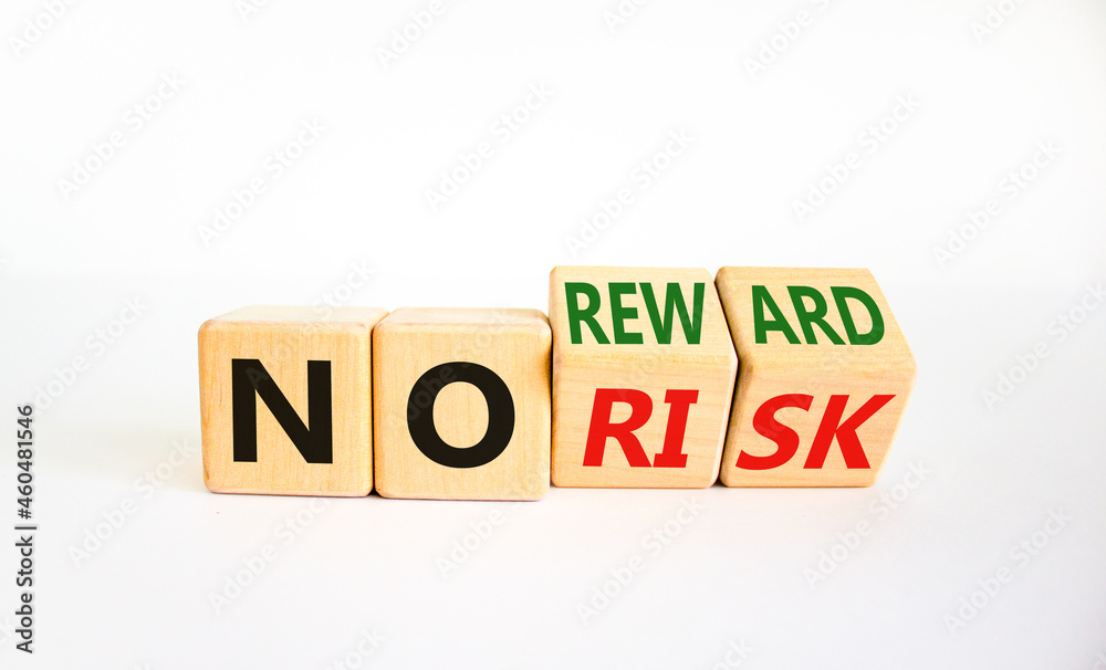 No risk or reward symbol. Turned cubes and changed words 'no risk' to 'no reward'. Beautiful white background. No risk or reward and business concept. Copy space. No risk or reward symbol. Turned cubes and changed words 'no risk' to 'no reward'. Beautiful white background. No risk or reward and business concept. Copy space.