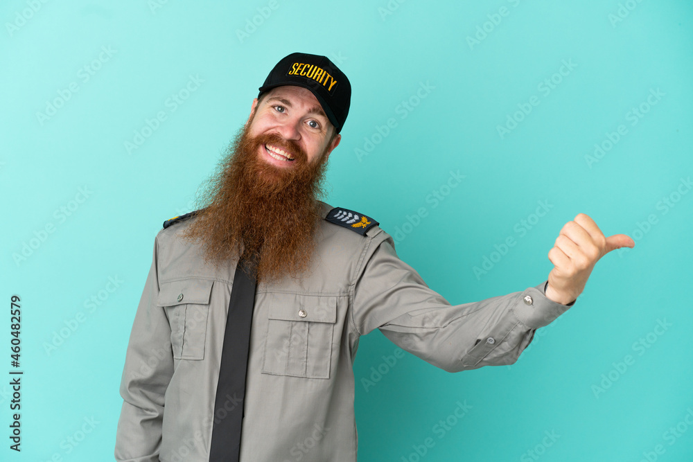 Redhead security man isolated on white background giving a thumbs up gesture Redhead security man isolated on white background giving a thumbs up gesture