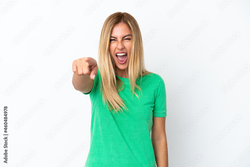 Blonde Uruguayan girl isolated on white background frustrated and pointing to the front Blonde Uruguayan girl isolated on white background frustrated and pointing to the front