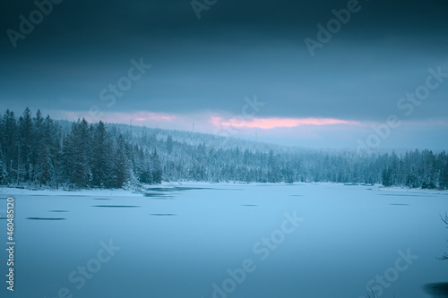 Wonderful natural morning scene of a frozen lake in the white winter mountains with dramatic clouds and weather. Oderteich, Harz Mountains National Park in Germany © Ricardo