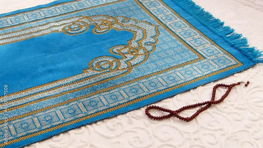 prayer rug and rosary, blue prayer carpet used for praying in Islam, prayer rug and rosary, blue prayer carpet used for praying in Islam,
