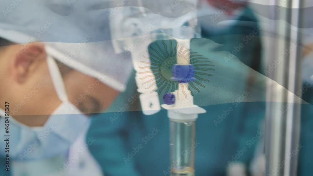 Animation of flag of argentina waving over surgeons in operating theatre Animation of flag of argentina waving over surgeons in operating theatre