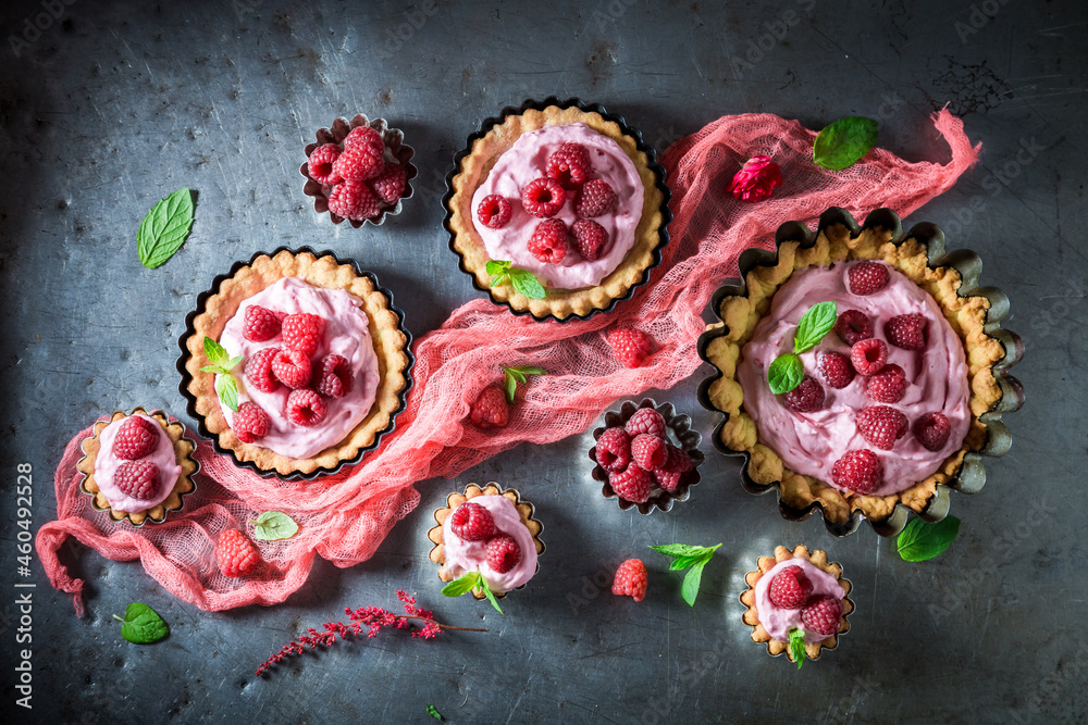 Homemade mini tart with raspberries and cream.
