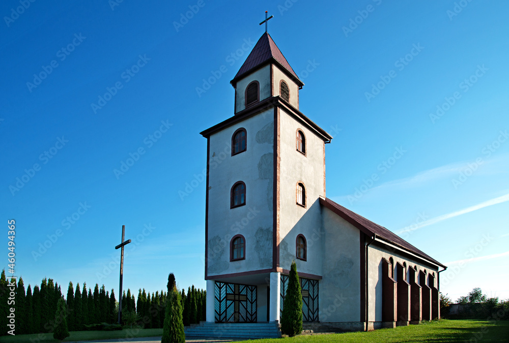 Naklejka premium General view and close-up of architectural details of the Catholic Auxiliary Church of Our Lady of Ostra Brama in Sędki in Masuria in Poland.