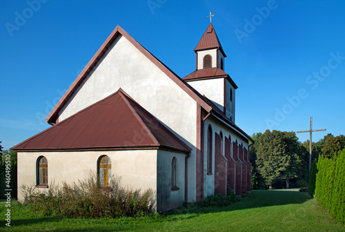 Fototapeta Naklejka Na Ścianę i Meble -  General view and close-up of architectural details of the Catholic Auxiliary Church of Our Lady of Ostra Brama in Sędki in Masuria in Poland.