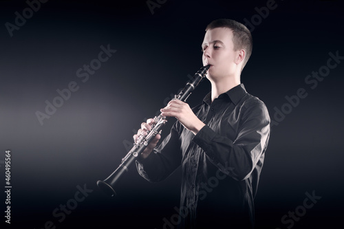 Clarinet player classical musician portrait. Clarinetist playing woodwind