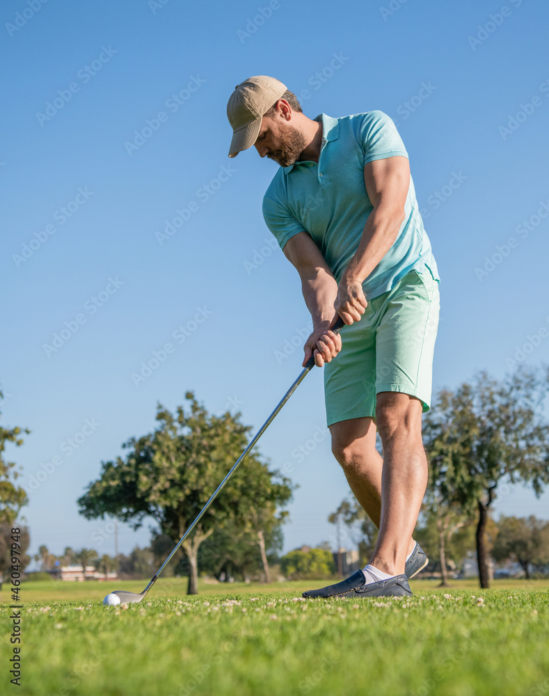 concentrated golfer in cap with golf club, golfing concentrated golfer in cap with golf club, golfing