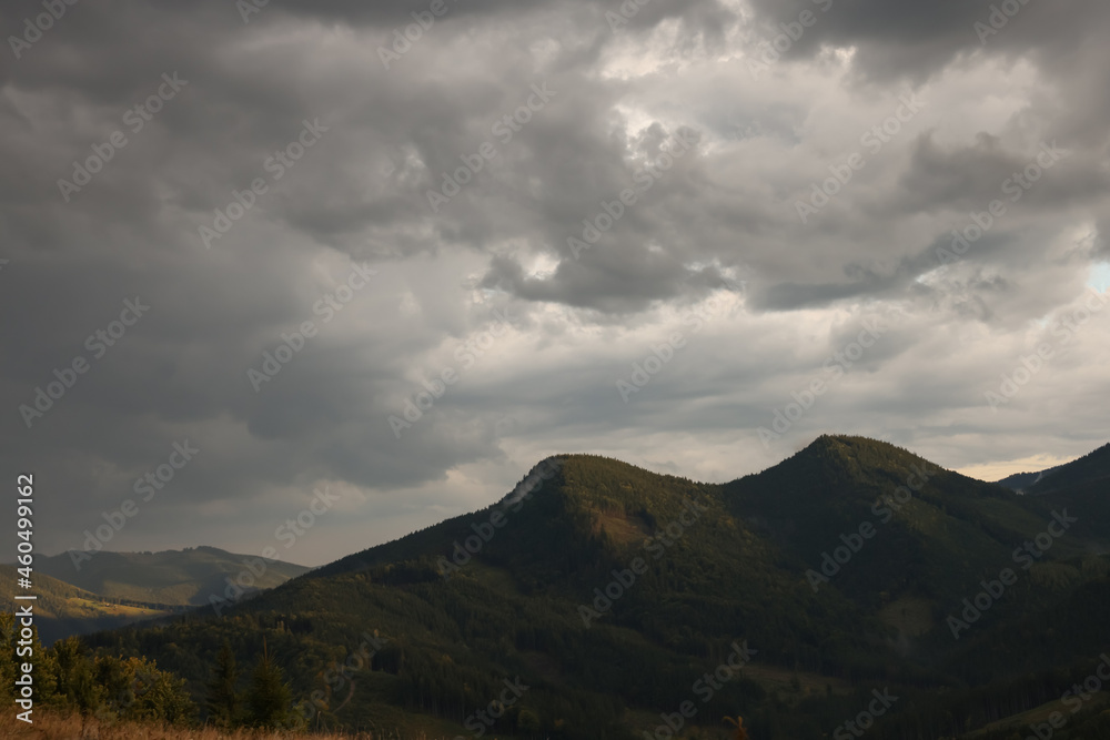 Picturesque view of cloudy sky over majestic mountain landscape Picturesque view of cloudy sky over majestic mountain landscape