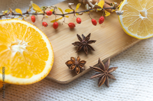 Fototapeta Naklejka Na Ścianę i Meble -  Oranges, lemons, spices and hot fruit tea.