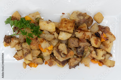 Overhead view of seasoned plate of o\'brien potatoes as a side order to a hearty breakfast in the morning photo